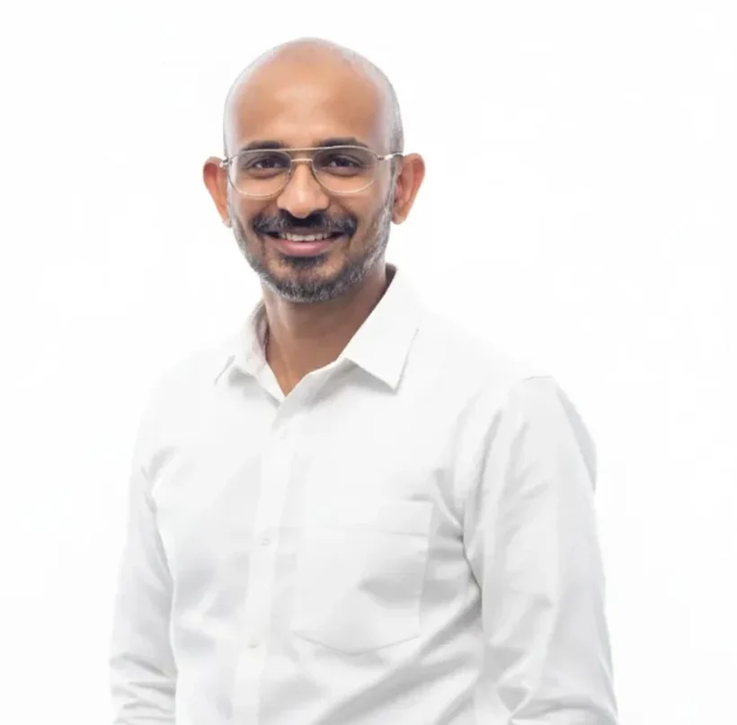 Zammy Zaif standing in a white shirt against a plain white background